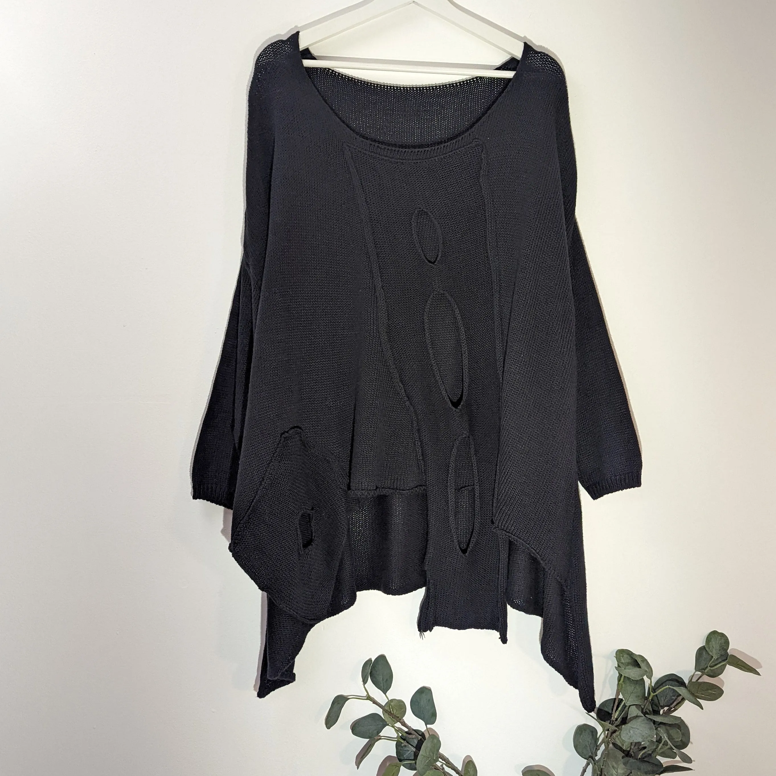 Fashionable holey cotton jumper with side pocket detail