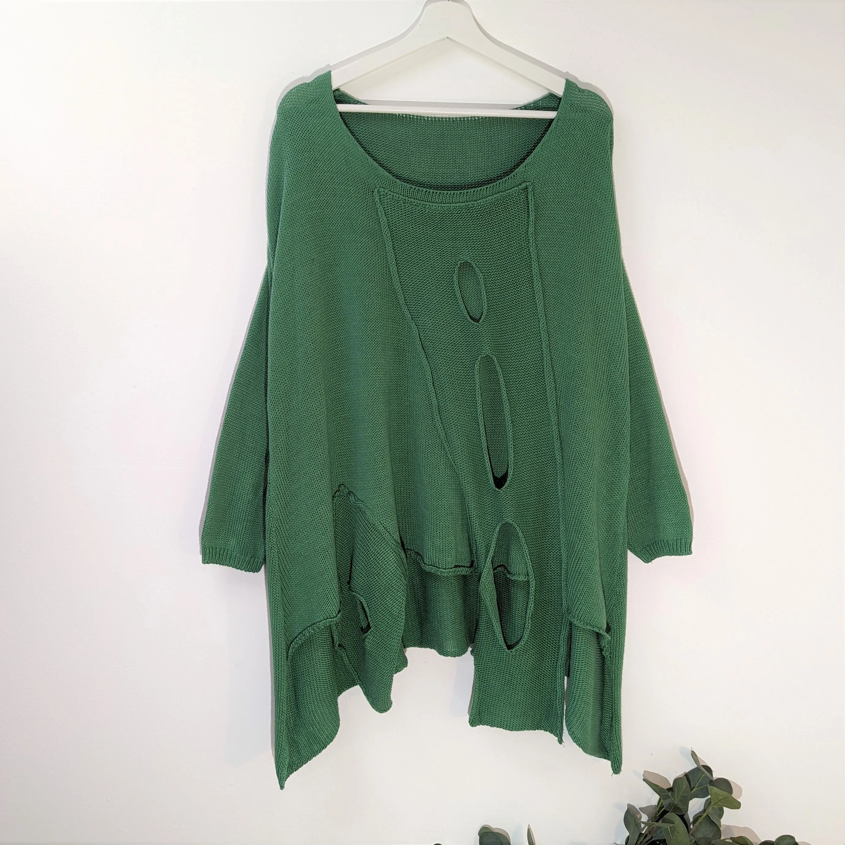 Fashionable holey cotton jumper with side pocket detail