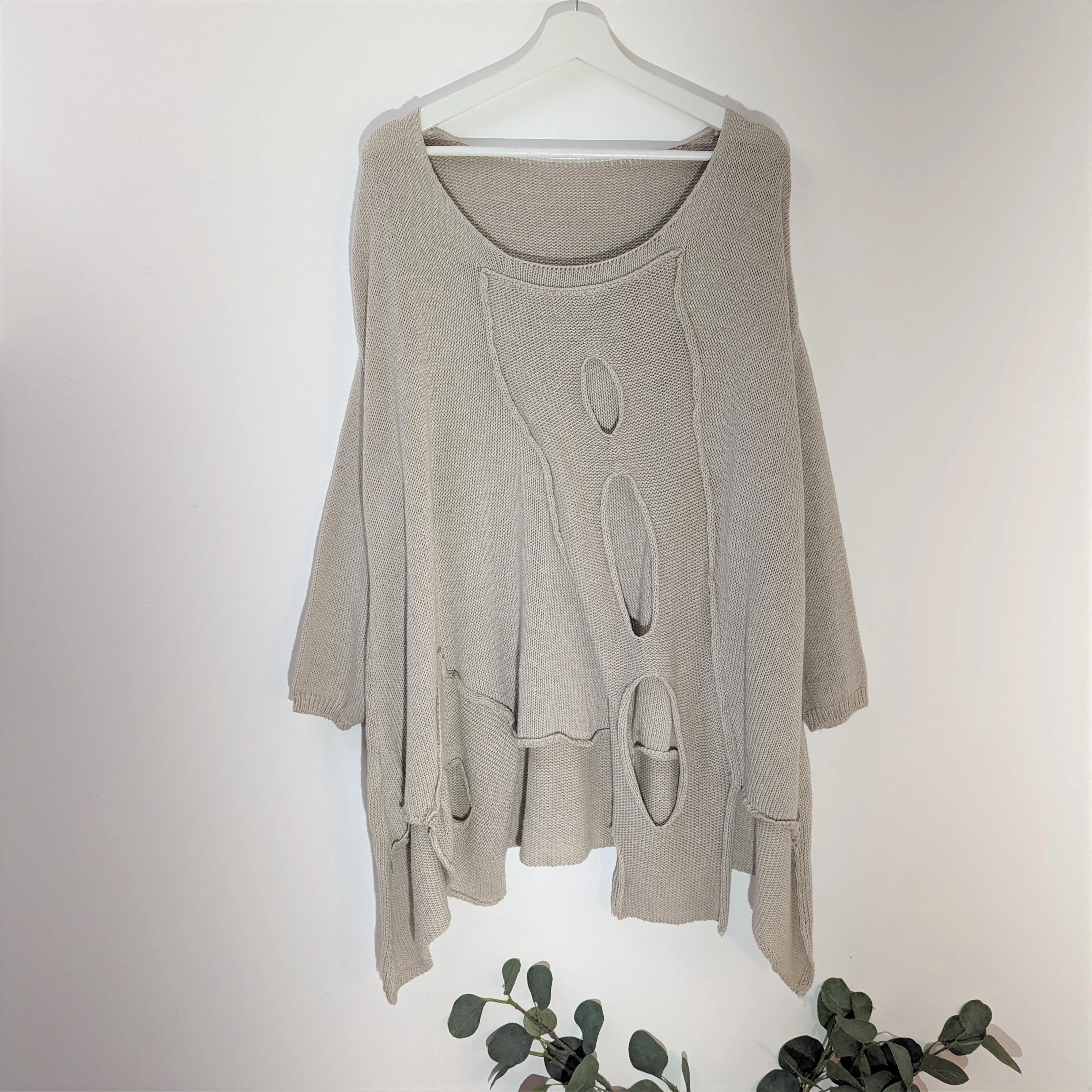 Fashionable holey cotton jumper with side pocket detail