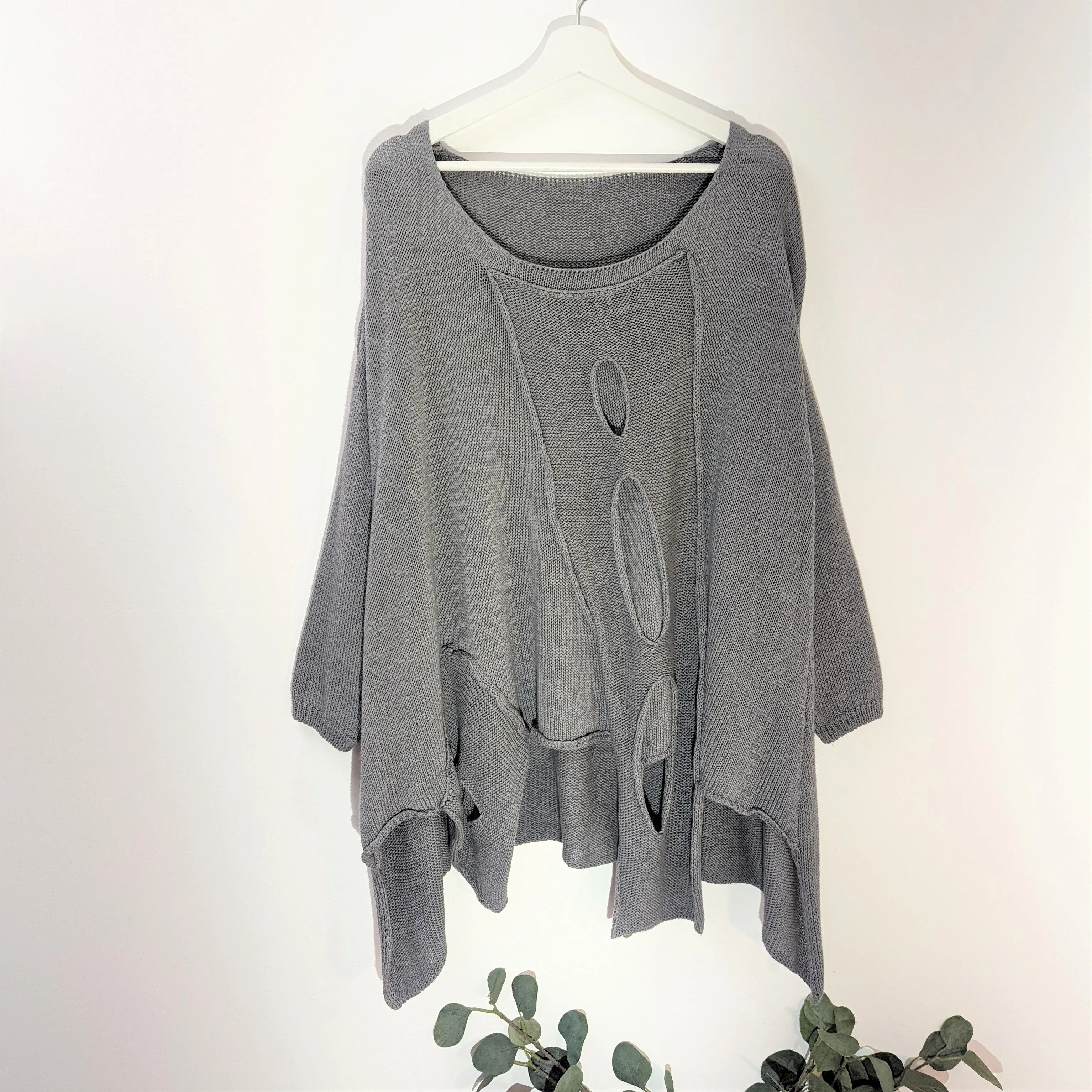 Fashionable holey cotton jumper with side pocket detail